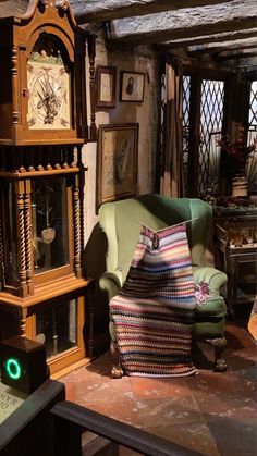 a living room filled with furniture and pictures on the wall