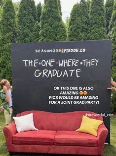 a red couch sitting in front of a blackboard with the words the one where they graduate