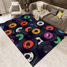 a living room area rug with various colored records on it