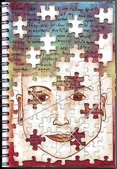 a spiral notebook with puzzles on it and a drawing of a man's face