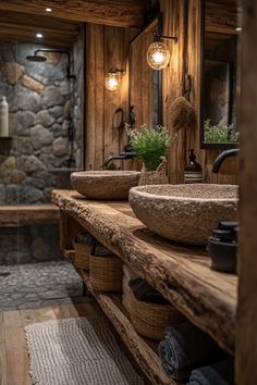 a rustic bathroom with stone walls and wooden fixtures, including two vessel sinks in the center