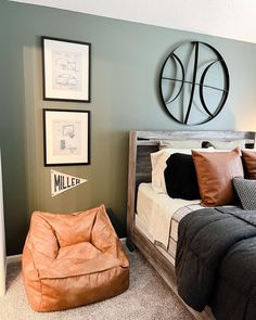 a bed room with a neatly made bed and a bean bag chair next to it