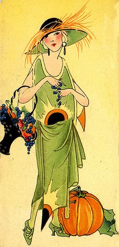 a woman in a green dress and hat with pumpkins