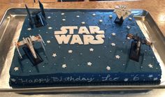 a star wars themed birthday cake on a tray