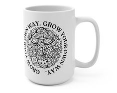 a white coffee mug with the words, grow your own and an image of a mushroom