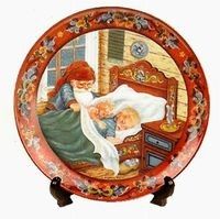 a plate with an image of a mother and her child on it, in the shape of a bed