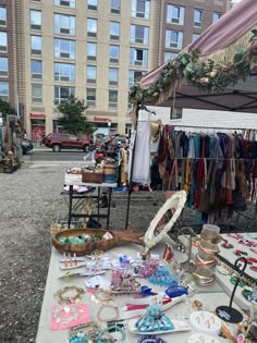 an outdoor flea market with lots of items on display