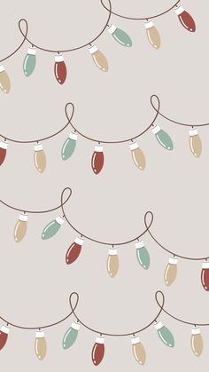 christmas lights are hanging from a string on a light gray background with red, green, and blue lights