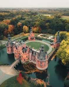 an aerial view of a castle surrounded by trees