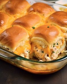 a casserole dish with chicken sliders in it and melted cheese on top