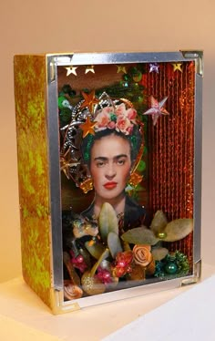 a box that has an image of fridace on it and flowers in her hair