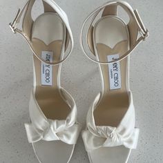 Jimmy Choo Authentic Rosie 120 Ivory Satin Platform Wedding Sandals Heels! Bought For My Wedding, But Ended Up With A Different Style. Original Price Is $1,050. Size 39, Fits Closer To An 8 Than 8.5 Would Be An Amazing Wedding Shoe. Luxury White Wedding Shoes With Padded Heel, Cream Open Toe Wedding Shoes With Wrapped Heel, Luxury Cream Wedding Shoes For Formal Occasions, Classic White Sandals With Wrapped Heel, Cream Open Heel Wedding Sandals, Off White Ankle Strap Heels For Formal Occasions, Elegant Off-white Heels With Heel Strap, Luxury White Open Heel Wedding Shoes, Elegant Off White Heels With Heel Strap