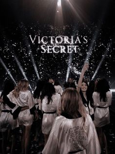 the victoria's secret show is being filmed on stage with people dressed in white