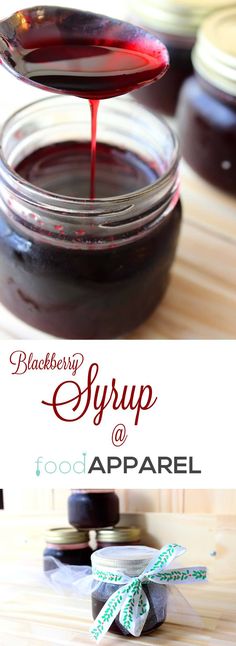 a spoon full of syrup sitting on top of a wooden table next to some jars