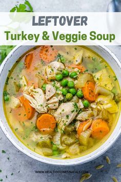 a white bowl filled with turkey and veggie soup