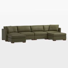 a large sectional couch with two ottomans