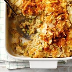 a casserole dish filled with chicken and rice