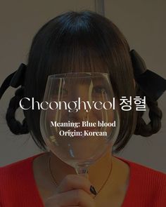 a woman holding a wine glass in front of her face with the words choonglwool meaning blue blood origin korean