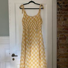 Tie-Shoulder, Smocked Yellow Gingham "Darby" Dress From Reformation. The Darby Is A Midi Dress With A Scoop Neckline. It Features Non Adjustable Arm Ties, Smocking On The Waist And A Scoop Neckline. Worn Only Once, This Dress Is In Almost-New Condition And Can Be Worn Dressed Up Or Casually Depending On Your Mood-- Perfect For Vacation, A Picnic Or Sunny Afternoon. Sunny Afternoon, Reformation Dress, Scoop Neckline, Yellow White, Smocking, Gingham, Colorful Dresses, Midi Dress, Dress Up