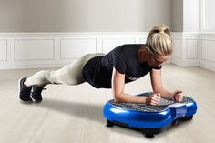 a woman is doing push ups on her laptop