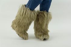 "Vintage yeti snow boots  Made in Italy 1980s Winter boots with longhair fur in beige color. Sheep wool inside (synthetic or real) Green rubber heel/sole.  In good condition. Some small signs of wear. To note:  Wear on lining Size : Women size (according to the label) EU37 US5,5 UK4,5 Measurements: Foot length (inner sole): 22,5cm - 8,8\" Length Outsole: 23,5cm - 9,2\" Width Outsole: 8cm - 3,1\" Height boot (incl. heel): 36cm - 14,1\" Height Heel: 5cm - 1,9\" Please note that our items are vintage and may have minor imperfections. For more details, product information or additional photos, please do not hesitate to contact us." Winter Fur Boots, Purple Bucket Hat, Fur Snow Boots, Real Green, Warm Winter Boots, Goat Hair, Ski Boots, Winter Snow Boots, Fur Boots