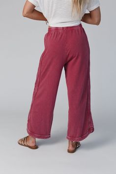 Comfy and cozy all in one! Our lounge pant features a wide leg, drawstring waist and pockets (yay!). It will be your closet fave to pair with graphic tees for lounging or on-the-go outfits! *Due to lighting and differences in monitors, actual colors may vary slightly from what appears online. Model is 5'8" and wearing size Small Approximate measurements are as follows: SMALL: Waist: 26", Inseam: 26 1/2", Length: 34" MEDIUM: Waist: 28", Inseam: 27", Length: 34 1/2" LARGE: Waist: 30", Inseam: 27 1 Trendy Cotton Bottoms For Loungewear, Trendy Cotton Loungewear Bottoms, Comfy Relaxed Fit Activewear With Drawstring, Comfy Activewear With Drawstring And Relaxed Fit, Cozy Relaxed Fit Cotton Activewear, Cozy Cotton Activewear With Relaxed Fit, Cozy Cotton Activewear For Lounging, Cozy Cotton Loungewear, Casual Wide Leg Soft-washed Bottoms