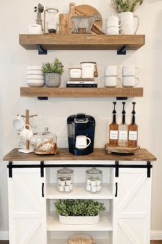 the shelves are filled with coffee, spices and other kitchen items on top of them