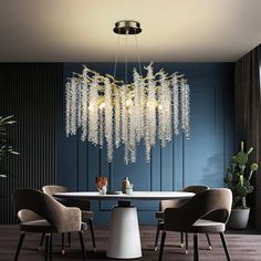 a dining room table with chairs and a chandelier hanging from the ceiling over it