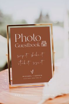 a photo guest book sitting on top of a table