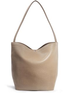 PRICES MAY VARY. Size: 17.5(L) x 13.3(H) x 7(W) inches, offering ample space for essentials like headphones, notebook, and water bottle. Conveniently designed with simple straps for easy conversion from a sling shoulder bag to a crossbody. Crafted from high-quality vegan leather, this hobo bag combines sturdiness with a soft touch for comfortable, all-day use. The modern shape and bucket style make it a versatile accessory for everyday wear. Features a magnetic closure for the main compartments Hobo Bags For Women, Beige Clothing, Slouchy Style, Bucket Bags, Hobo Bags, Leather Bucket Bag, Leather Bucket, Shoulder Handbag, Leather Hobo