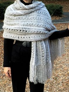 a woman wearing a white knitted shawl