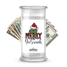 a glass jar filled with money and the words merry christmas ya grin