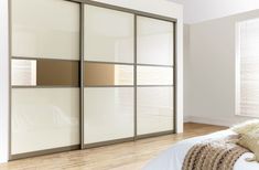 an image of a bedroom setting with sliding doors