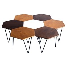 four wooden tables with black hairpin legs on each side and brown wood top, all in different shapes and sizes