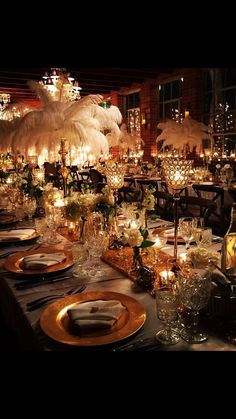 a long table is set with candles and place settings for an elegant dinner or party