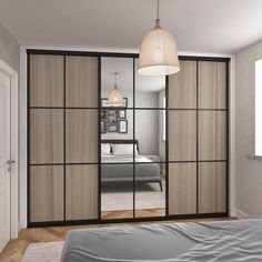 a bedroom with sliding glass doors and a bed