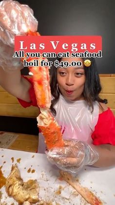 a woman holding up a large piece of food in front of her face with the caption las vegas all you can eat seafood boil for $ 99 00