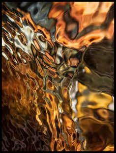 an abstract photograph of fire and water in black frame with white border around the edges