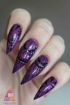 Check out these creepy but cool nails. With stitches and halloween vibes. Discover more purple nails options and designs at NailHow.com! Nails Dark Design, Clawdeen Nail Ideas, Purple And Black Nails Acrylic, Purple Nails Halloween, Purple Gothic Nails, Halloween Purple Nails, Dark Purple Halloween Nail Designs, Purple Spooky Nails, Black And Purple Nail Designs