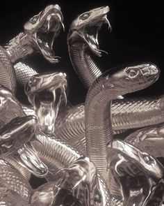 an image of some silver snakes in the air