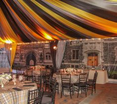 the inside of a banquet hall with tables and chairs set up for an outdoor function