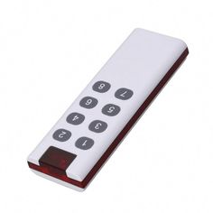 a white remote control sitting on top of a table