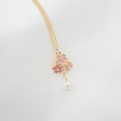 🎉Dainty enamel cherry blossom pendant necklace 🎉Design and handcraft in our Burlington Studio ------------------------------------------------------------- PRODUCTS DETAILS Pendant: 25X12mm Pendant: 14K gold plated enamel & organic freshwater pearl Chain: 14K gold filled Chain length: 16"/18"/20"/22" available from drop-down list, other length pls leave me a message for customization Model: 18" chain ------------------------------------------------------------- SAME COLLECTION Earrings https://www.etsy.com/ca/listing/1608781952/dainty-cherry-blossom-earrings-tiny?click_key=4d53af10eed15617443293642b755600955cf955%3A1608781952&click_sum=77c72d72&ref=shop_home_active_1&frs=1&sts=1 ------------------------------------------------------------- PACKAGE Gift packed: Jewelry box + bow + cleanin Cherry Blossom Necklace, Pink Sakura, Necklace Design, Jewelry Tree, Pearl Wedding, Swarovski Pearls, Pearl Chain, Gold Filled Jewelry, Bridesmaid Jewelry