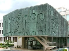 a large building with many carvings on the side of it's face and stairs