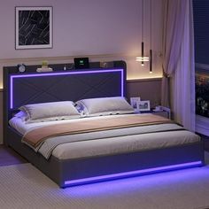 a large bed with lights on the headboard and foot board