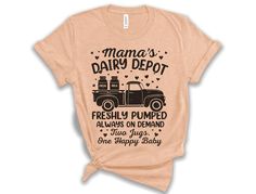 Mama's Dairy Depot T-Shirt: The Funniest Gift for New Moms Looking for a Funny Breastfeeding Gift for New Moms? This New Mom T-Shirt adds a touch of humor to the joys and challenges of motherhood. With playful text, "Freshly Pumped, Always on Demand - Two Jugs, One Happy Baby," it's the perfect Baby Shower Gift Idea or Mother's Day Gift. Made for nursing moms, this comfortable tee will become a go-to favorite. Whether you're gifting a friend or treating yourself, this Funny Breastfeeding Shirt brings laughter to any postpartum wardrobe. Printed with eco-friendly water-based inks.  Please refer to the size chart in the listing images (laying flat measurements in inches). Due to the calibration differences between computer monitors, phone screens and tablets, the actual product color may var Postpartum Wardrobe, Breastfeeding Shirt, Baby Shower Gift Idea, Nursing Mom, Phone Screens, Perfect Baby Shower Gift, Happy Baby, New Mom, Gifts For New Moms