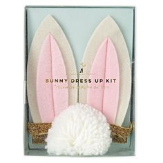 the bunny dress up kit is packaged in a box with gold glitter trimmings