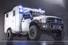 a white truck with lights on it's bed