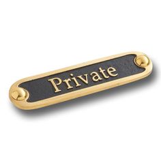 a black and gold plate with the word private on it