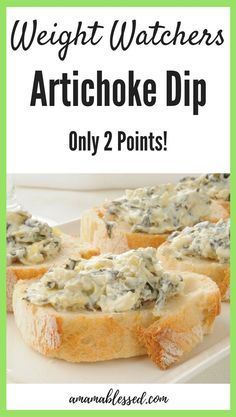 a white plate topped with pieces of bread covered in spinach artichoke dip